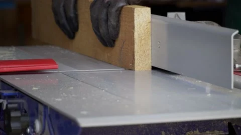 Close up carpenter works on planing machine in workshop. Woodworking Video stock 168199846