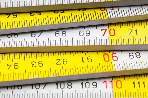 Close up of a carpentry ruler on white background Stock Photos