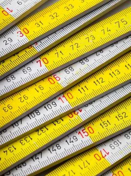 Close up of a carpentry ruler on white background Stock Photos