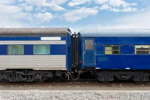 Close-up of carriages of passenger train in blue Stock Photos