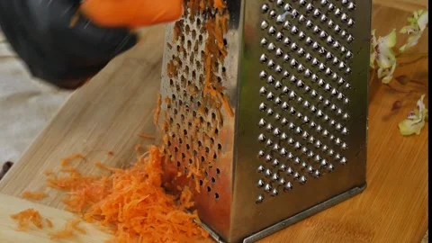 Close-Up of Carrot Being Grated Stock Footage 311318426