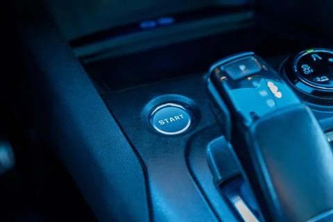 Close-up of a cars start engine button and central console with gear shift Stock Photos