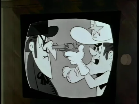 Close-up cartoon playing on television set Stock Footage 261022347