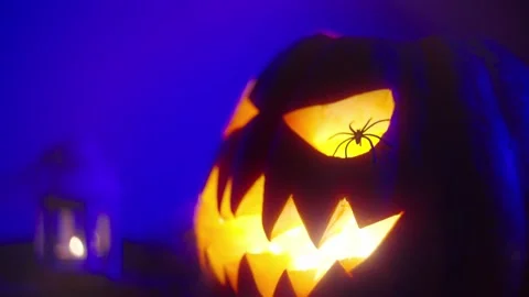 Close-up of a carved scary, evil-smiling grimace of a pumpkin. Stock Footage 217949686