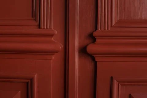 Close up of carved three-dimensional elements of the bevels of old entrance.. 스톡 사진
