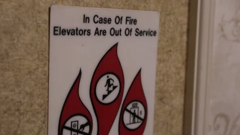 Close up in case of fire sign move up from elevator button 스톡 동영상 101131542