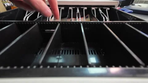 Close-up of a cash register drawer opening with money inside Stock Footage 334811922