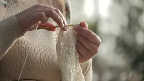 Close up of cashmere crochet work from sheep's wool. Hands of an Stock Footage 274278026