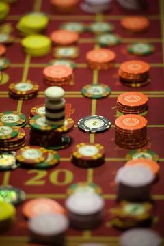 Close-up of casino chips on the red table Fotos de archivo