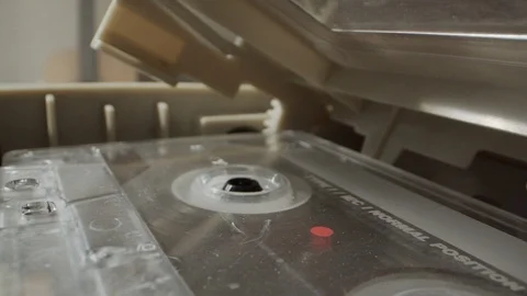 Close on cassette tape playing in player 스톡 동영상 107148003