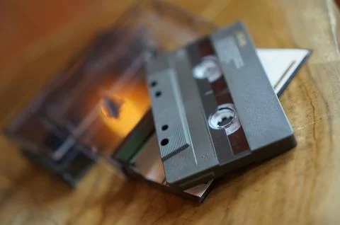 Close-up of a cassette tape on a table, selective focus Stock Photos