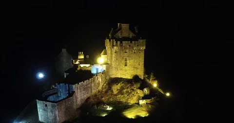 Close up of Castle lit up at night time from above. drone aerial 4K Stock Footage 104584836
