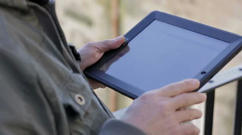 Close up of casual man holding digital tablet, outdoor Video stock 34278455