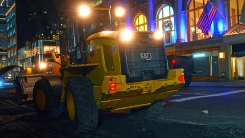 Close up of CAT front loader during night construction Stock Footage 333213935