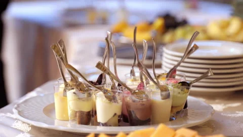 Close-up of catering banquet menu on buffet table, small goblets filled with Stock-Footage 140822072
