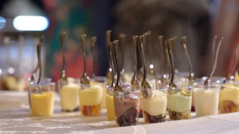 Close-up of catering banquet menu on buffet table, small goblets filled with Stock-Footage 142024717