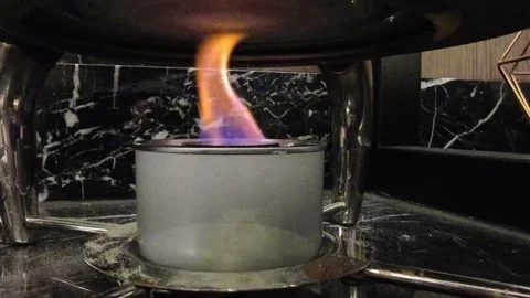 Close‑up of a catering chafing dish fuel burner Stock Footage 344320554