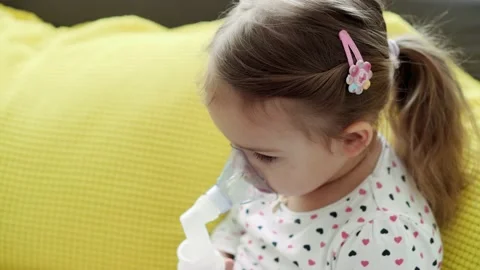 Close up Caucasian 3-4 years minor preschool girl kid in the mask of an inhaler Stock Footage 149079817