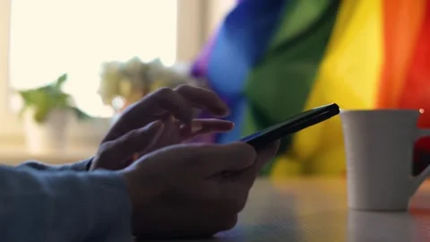 Close-up of caucasian homosexual man using mobile phone Stockbeeldmateriaal 197997617