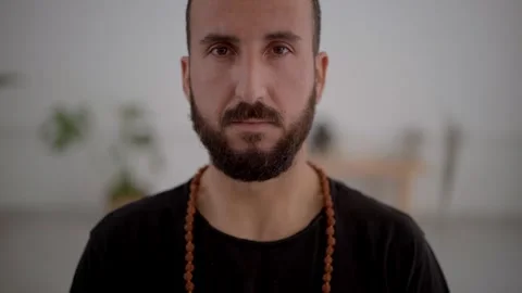 Close up Caucasian man with beard doing yoga meditation. Middle-aged male Stock Footage 248865806