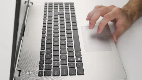 Close up, caucasian man using touchpad, trackpad on laptop with his hand  Stock Footage 138041966