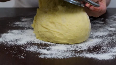 Close up of caucasian old chef man shaping a bread loaf. Retired elderly baker Stock Footage 326003616