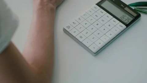 Close-up of Caucasian woman's hand while working in office uses computer and Stock Footage 220938191