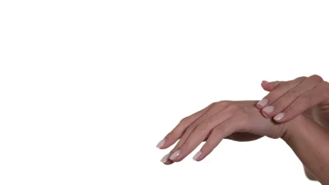 Close up of a Caucasian woman's hands, applying moisturizer hand cream. White Stock-Footage 158019999