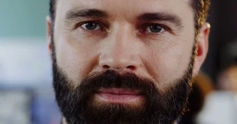 Close up of caucasias man with a beard looking and smiling sincerely straight Stock Footage 82445261