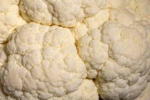 Close up cauliflower head surface texture compact edible florets pattern Stock Photos