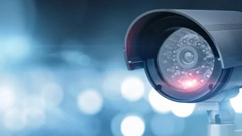 Close up of CCTV camera over defocused background with copy space Stock Photos