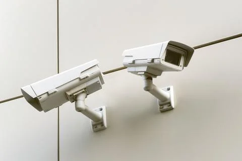 Close up of CCTV camera over defocused background Stock Photos