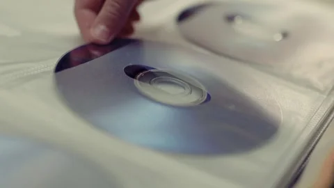 Close up of cd discs in a holder. Disc with data,movie or music. Stock Footage 301555816