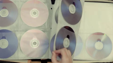 Close up of cd discs in a holder. Disc with data,movie or music. Stock Footage 301555957