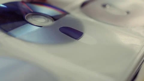 Close up of cd discs in a holder. Disc with data,movie or music. Stock Footage 301556028