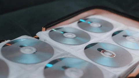 Close up of cd discs in a holder. Disc with data,movie or music. Stock Footage 301556398