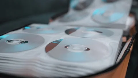 Close up of cd discs in a holder. Disc with data,movie or music. Stock Footage 301556400