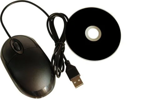 Close up of a cd dvd disc and a computer mouse on white background Stock Photos