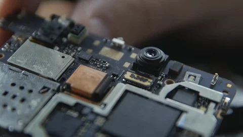 Close-up of a cell phone repair. The internal components of a smartphone. Dis Stock Footage 113398541