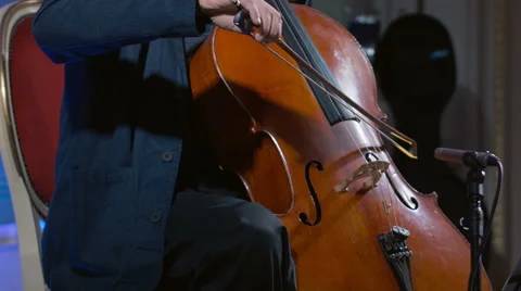 Close-up of a cello player bowing his instrument Stock Footage 52056607