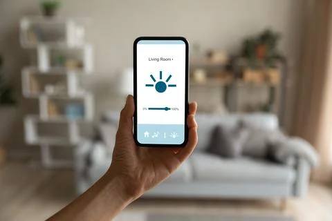 Close up cellphone with smart home application on screen. Stock Photos