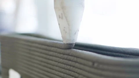 Close up Cement Printing Machine is printing layers sculpture 50fps Video stock 243975504