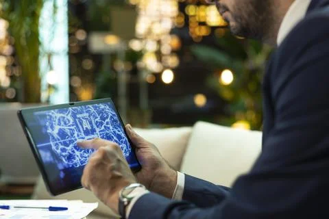 Close up of CEO uses artificial intelligence interface on tablet Stock Photos