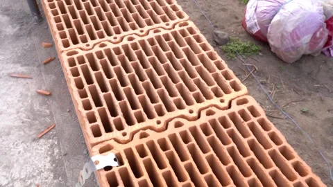 Close-up of ceramic blocks showing structural wall pattern on construction site Stock Footage 310549763