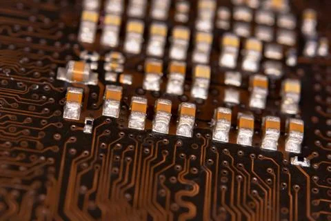 Close up ceramic capacitors on electronic circuit board Stock Photos