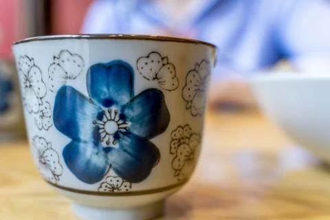 Close-up of ceramic Chinese Teacup with Cherry Blossom motifs 库存照片