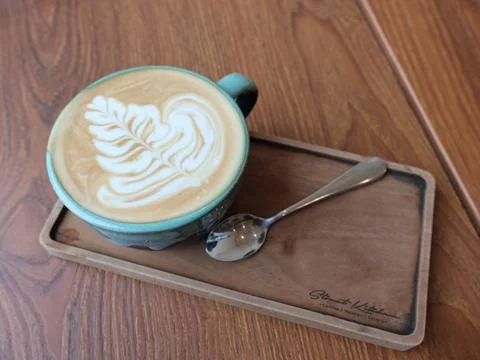 Close-up a ceramic cups filled with latte art coffee Stock Photos