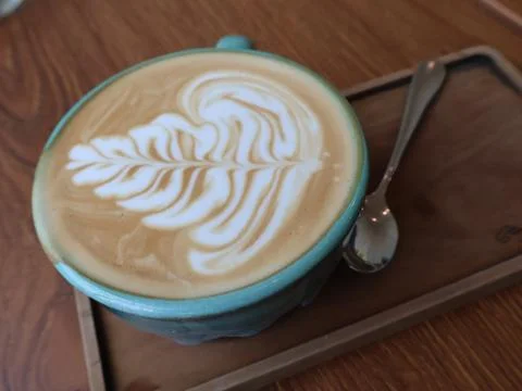 Close-up a ceramic cups filled with latte art coffee Stock Photos