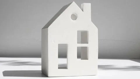 Close-up of a ceramic figurine in the form of a house with windows Stock Footage 196114771