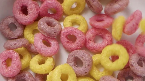 Close up of cereal circles falling into a bowl Stock Footage 158169011